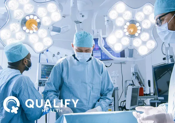 Hospital operating theatre with surgeons working together