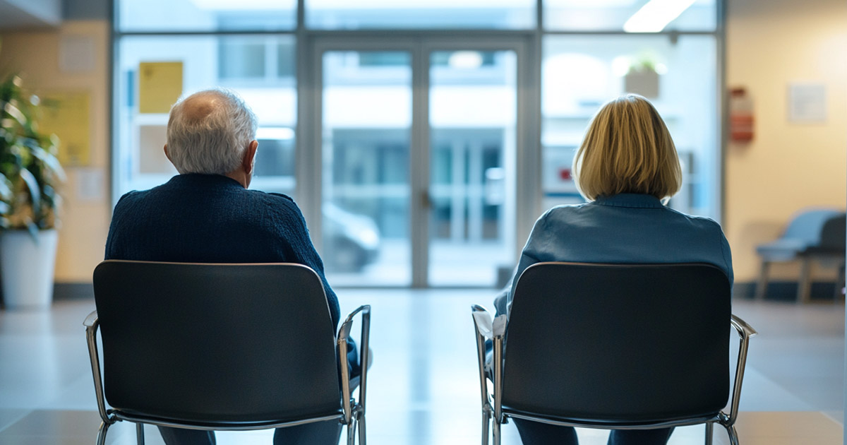 Senior couple in hospital waiting room amid medicaid funding cut concerns