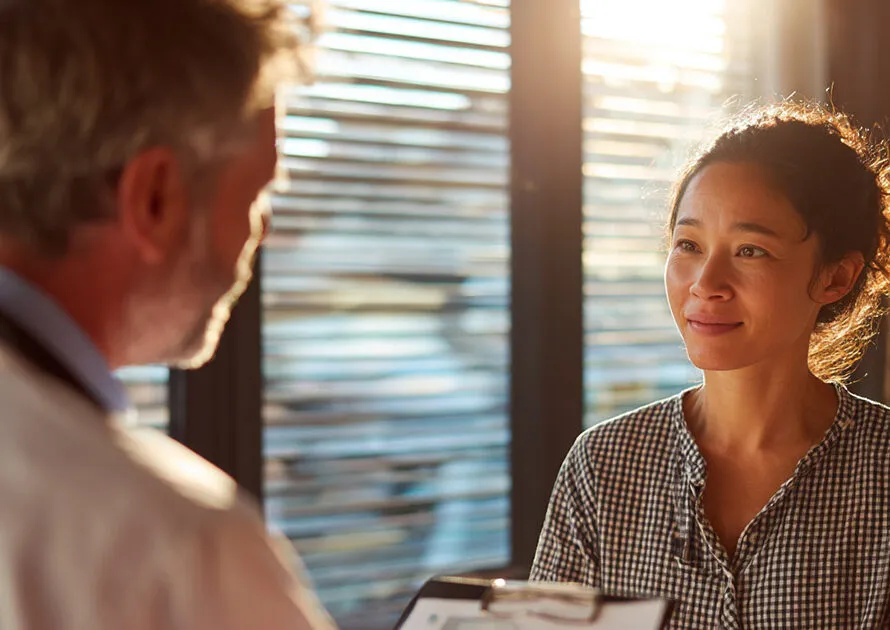 Doctor discussing treatment funding options with a patient