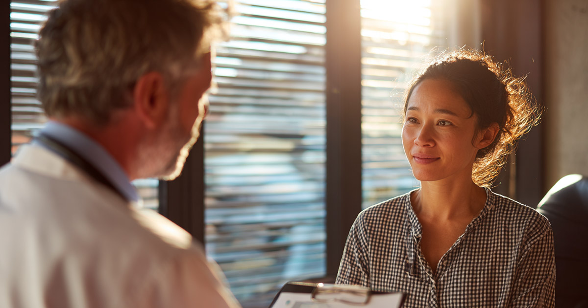 Doctor discussing treatment funding options with a patient
