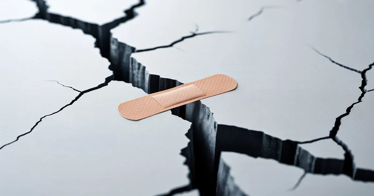 Bandage on crack symbolizing problems with patient assistance programs